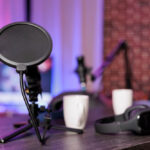 USB condenser microphone with pop filter on desk setup for podcasting, programming, and video calls