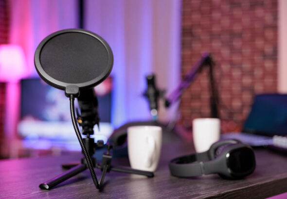 USB condenser microphone with pop filter on desk setup for podcasting, programming, and video calls